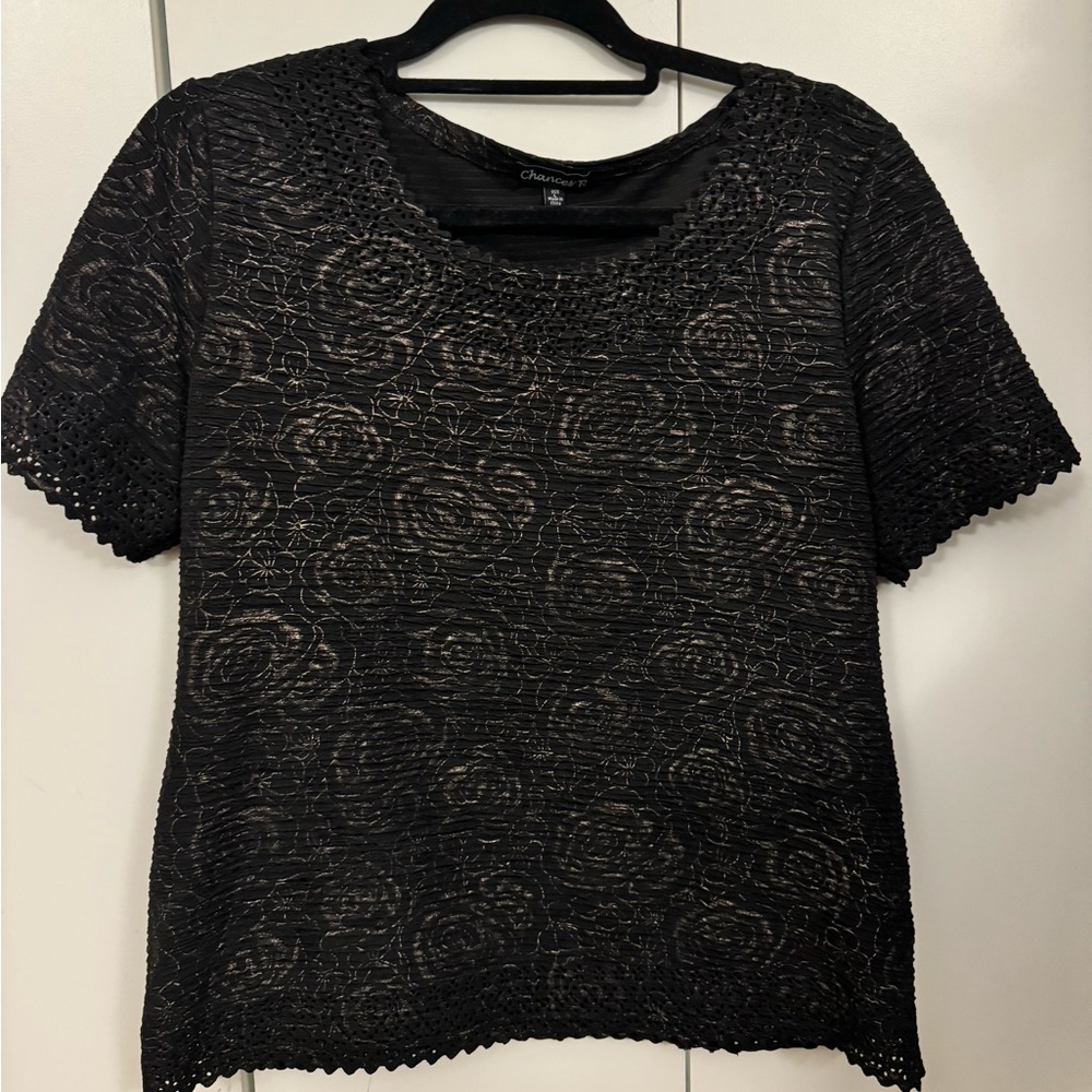 Size large black top with gold accented florals